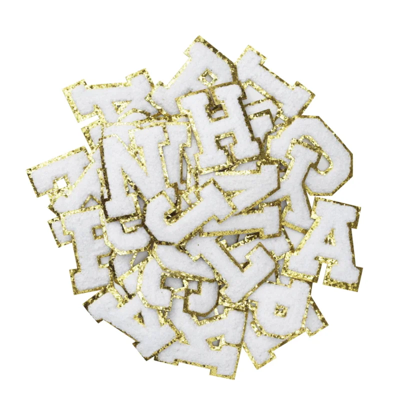 Lägg i varukorgen Iron-On bokstäver, vita med guldglitter, 40 st. A–Z, längd 6 cm