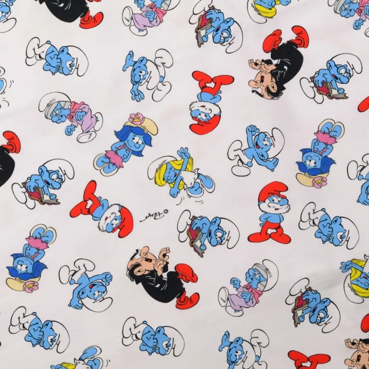 Trikåtyg Smurfarna - Vit botten Extra rabatt